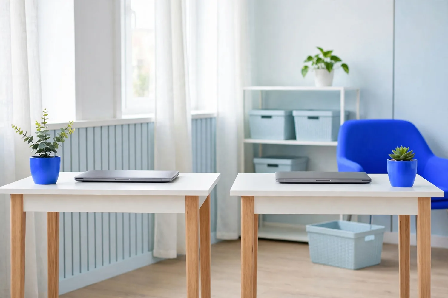 Two desks with laptops